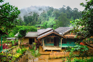 Fototapeta na wymiar Rural mountain little village with typical Indonesian green house and and little garden on the mount Salak, west Java, Indonesia