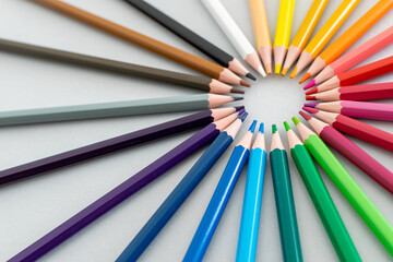 Fototapeta premium a close up on a set of coloured pencils set up in a circle 