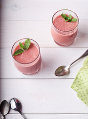 Two strawberry soup in glasses on table