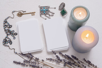 Blank tarot cards with copy space on the white table background.