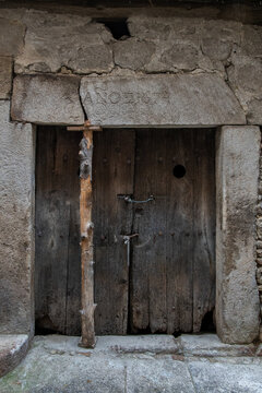 Ancient door dating in 1674 according inscription on the lintel. Old town of Mogarraz. Spain.