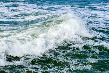 a big wave on the Baltic sea coast during a storm