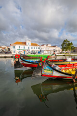 Colorful Moliceiro boat rides in Aveiro are popular with tourists to enjoy views of the charming canals.