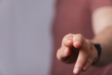 Hand pushing on a touch screen.