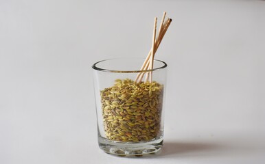 Fennel seeds and toothpicks in designer glass