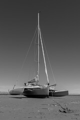 Twin deck catamaran sail vessel run upon the sands on Terschelling island; strike bottom; get...