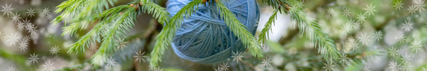 Christmas tree and yarn balls as decorations background