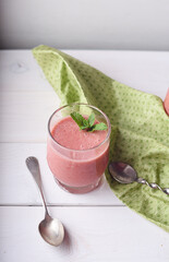 Cold strawberry soup with mint in glass