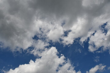 Fototapeta premium Beautiful white fluffy clouds on a blue sky
