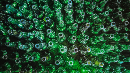 Full frame of empty cider green bottles