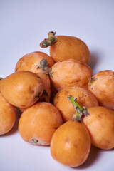 Set of medlars in order on white table