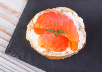 Salmon mini sandwiches on black slate board