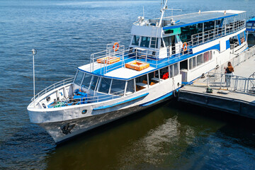 06/06/2020. Ukraine. Kiev. River pleasure boat moored to board passengers on deck.