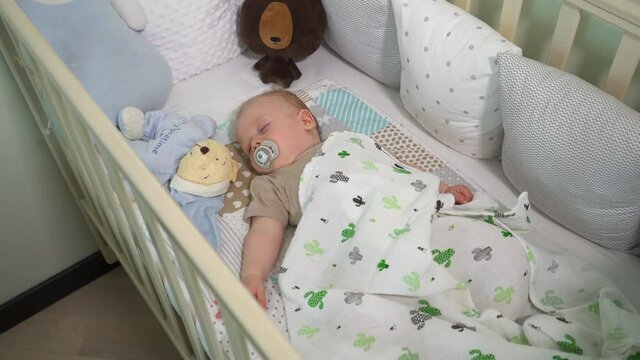 baby sleeps in the crib
