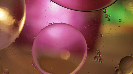 Macro structure of colorful oil bubbles. Chaotic motion. Abstract multicolored background. Pattern