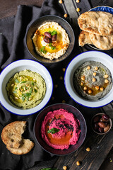 Traditional hummus with different flavours 