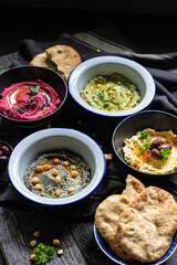 Traditional hummus with different flavours 