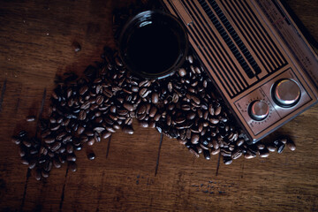Grinded Arabica coffee beans with vintage wooden background