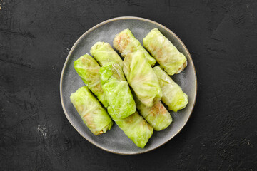 Naklejka na ściany i meble Rolled cabbage leaves stuffed with ground meat, rice and onion