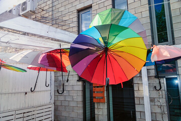 Colorful umbrellas in a street, Warsaw, Poland