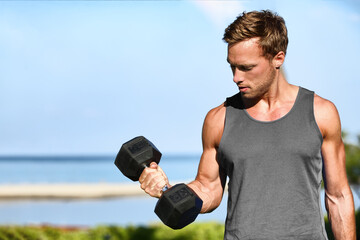 Bicep curl free weights training fitness man outside working out arms lifting dumbbells doing...