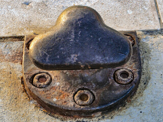 An old rusty mooring bollard in a harbour, Split, Croatia
