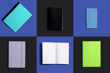 Variety of notebooks and notepads on tiled desk flatlay from above