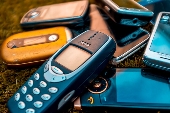 London, England - July 12, 2019: Selection of old mobile cell phones from the mid 2000's before the introduction of Smartphones