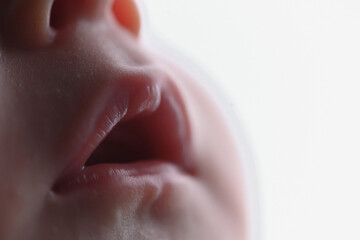 Naklejka premium Foto em detalhe da boquinha de um bebê