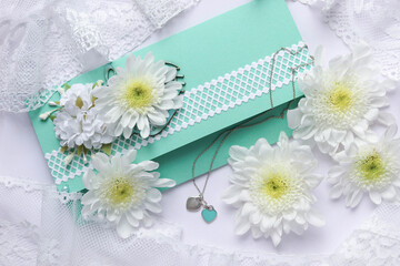 card for invitation or congratulation with flowers. wedding bouquet with blank card. white chrysanthemum flowers