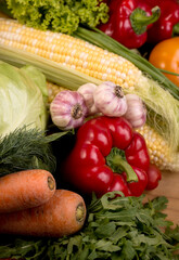 Assortment of fresh raw vegetables on a wooden table. Healthy food Top view background with empty space.