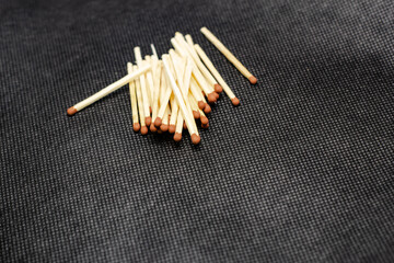 Match, on a black background. Macro shot, perfect for a shelf and for further post-production.