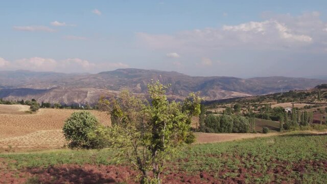 Sebinkarahisar city in north center Turkey in drought mountains landscape. Kalesi Castle. Aerial drone wide view at summer sunny day