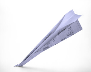 paper plane made from engineering drawing crashing on white background