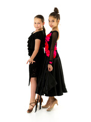 Two little girls in the studio, happy childhood concept.