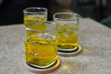 Cold fresh green iced tea in a bar in Saigon / Ho Chi Minh City. The weather is muggy warm, high humidity, the iced tea is refreshing at any time of the day.