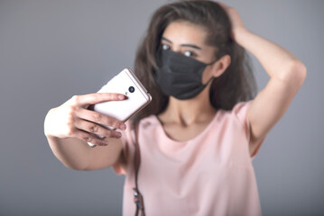 woman face mask and selfie