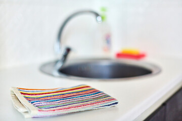 Kitchen towel and sink without dirty dishes background.