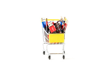 Usb wires in red, blue and black colors in a miniature shopping cart. Purchase of a usb cable.
