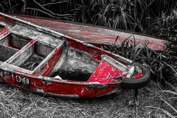 Red wooden fishing canoe