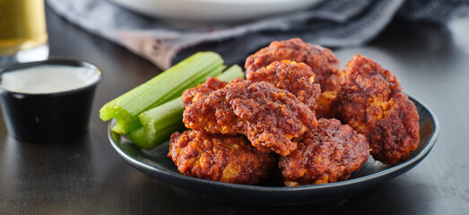 crispy fried boneless wings with nashville hot flavor