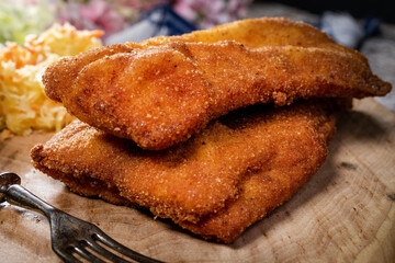 Two fried cod fillet pieces.