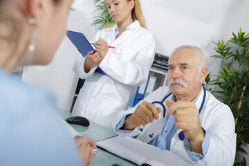 Obraz premium senior male doctor and nurse