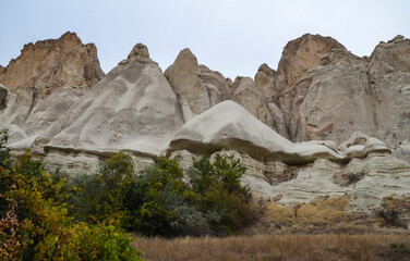Photo of beautiful unique Mountain landscape with fairy chimneys in Goreme, Cappadocia, Turkey