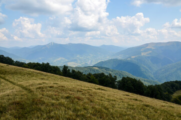 Beautiful landscape of summer mountains with mountain valley, blue sky and clouds. Carpathians Ukraine
