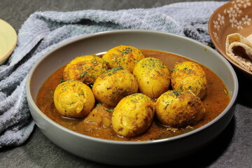 An Indian spread of spicy Egg curry or Egg Masala in a bowl