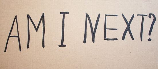 AM I NEXT. Text message for protest on cardboard. Stop racism. Police violence. Banner design concept.