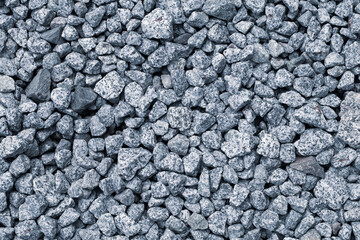 Graphic pattern formed by granite gravels of grey colour
