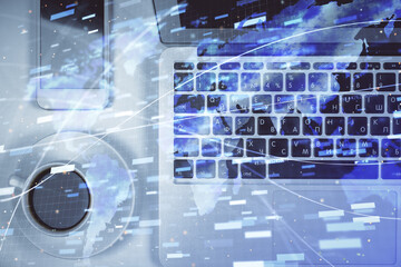 Multi exposure of data theme drawing hologram over topview work desk background with computer. Concept of technology.