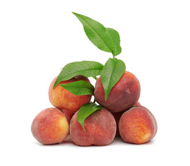 heap of ripe red peach and green leaves, sweet fruit